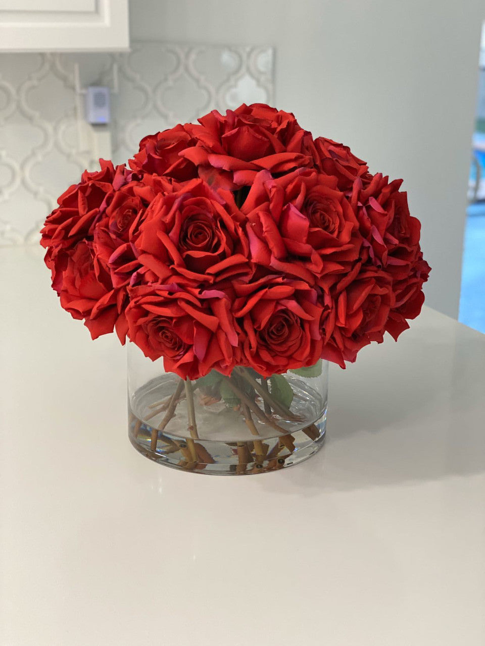 Red Rose Bloom Arrangement in Glass Cylinder Vase